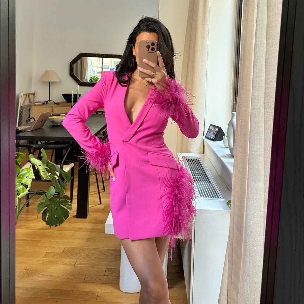 Miss Circle magenta mini blazer dress with feathers.
